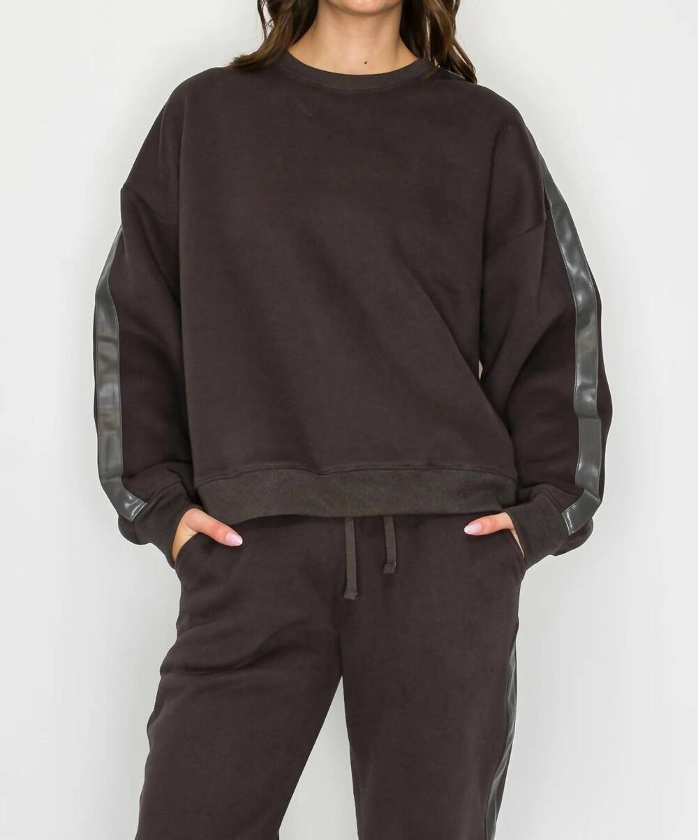 NEW KNIT RIOT stride track sweatshirt in charcoal